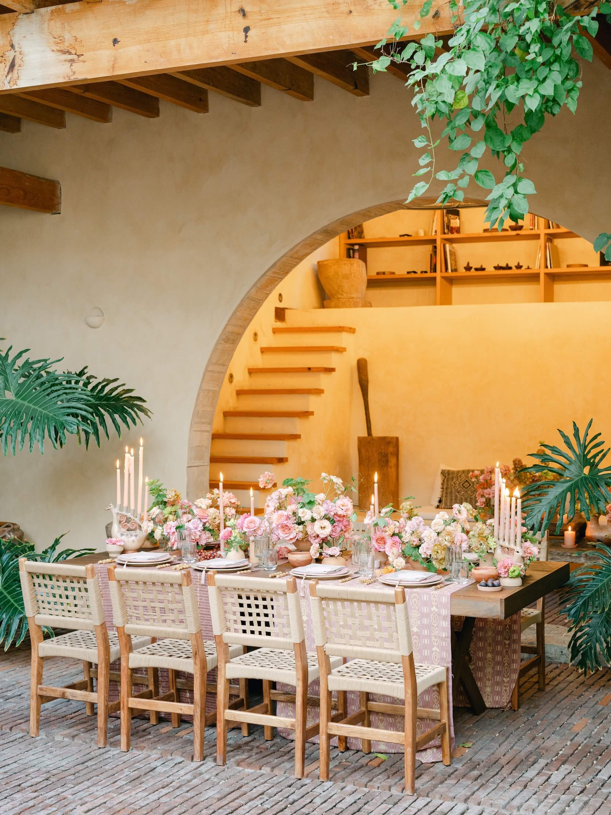 high-end wedding styling with bride holding organic floral arrangement