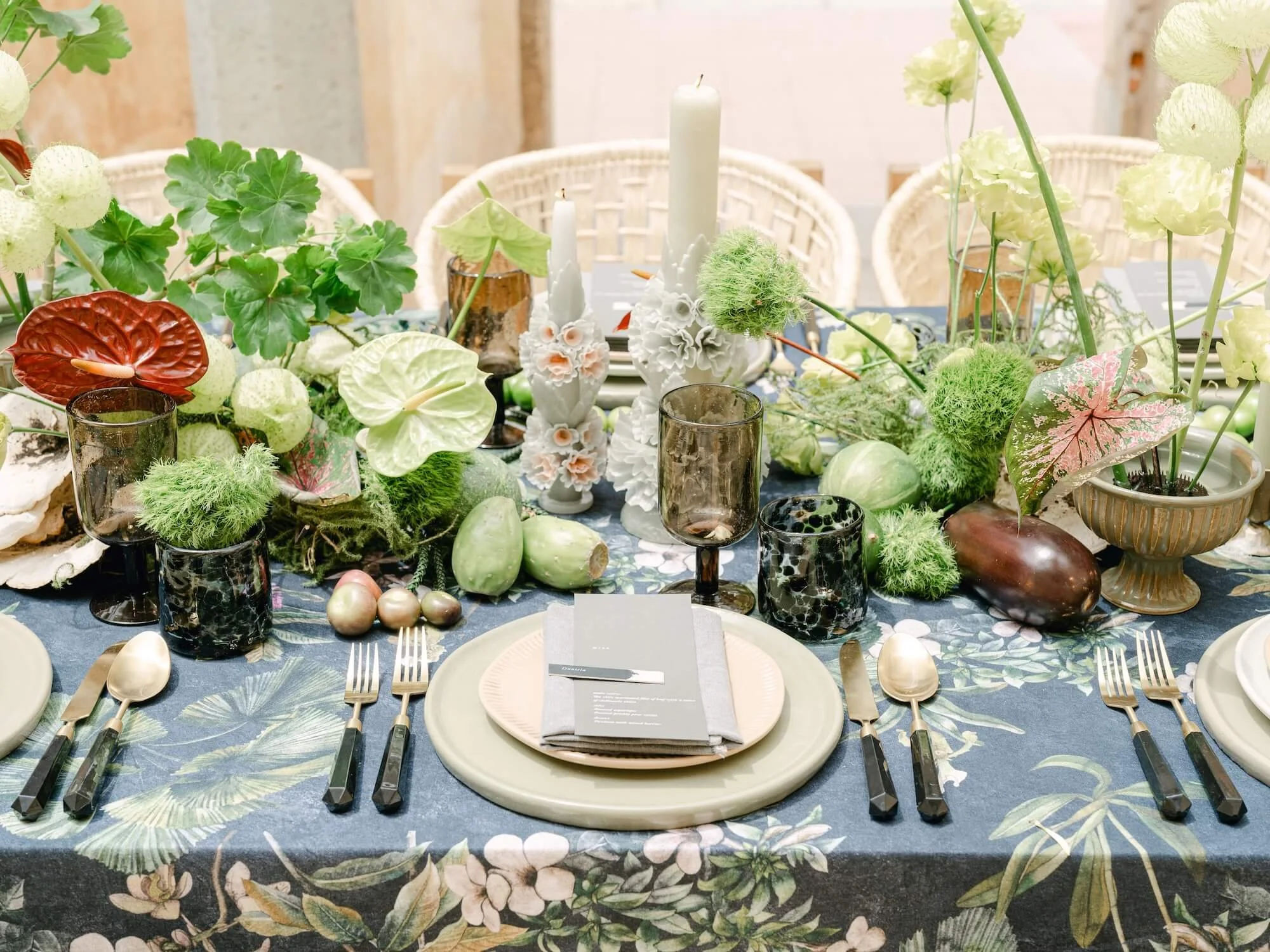 bride and groom celebrating outdoor wedding with floral details and greenery installation Mexico
