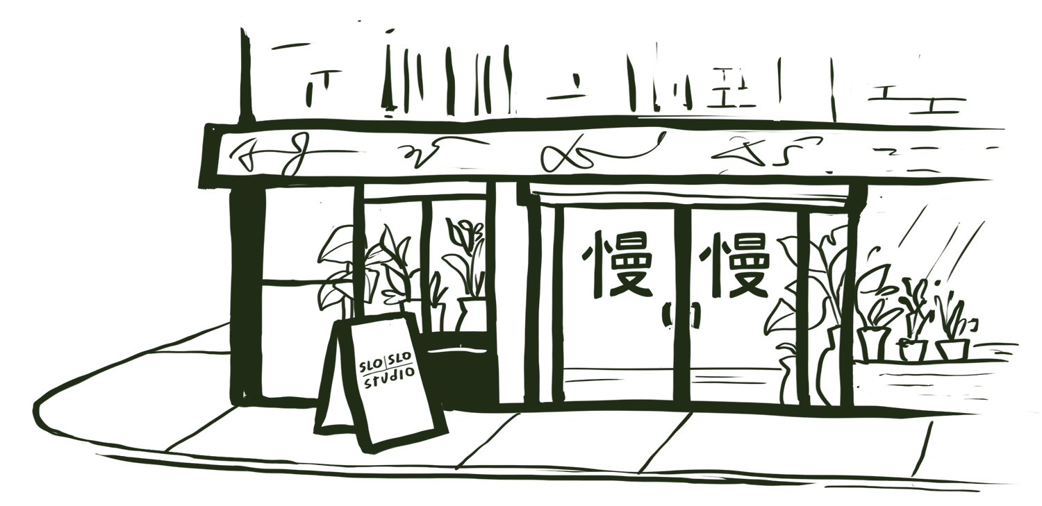 Illustration of a corner storefront with plants near the windows. The entrance has double doors, each displaying a Mandarin logo sign for ‘Slo Slo.’ A sidewalk sign on the lower left reads ‘Slo Slo Studio.