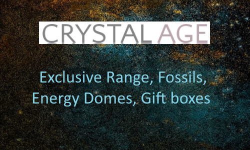 Text on a dark, cosmic background promoting CRYSTAL AGE with items like exclusive range, fossils, energy domes, and gift boxes.