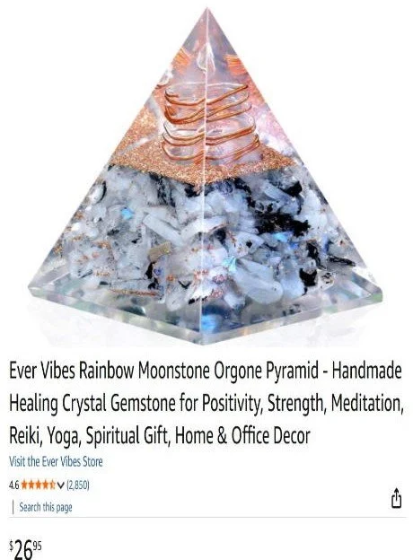 A clear, multi-layered pyramid-shaped gemstone with a rainbow rainbow moonstone and orgone elements, used for healing and meditation.