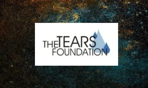Logo for The Tears Foundation with a blue tear drop design.