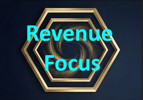 A geometric design with a black center and gold hexagonal border, overlaid with the words "Revenue Focus" in bright blue text.