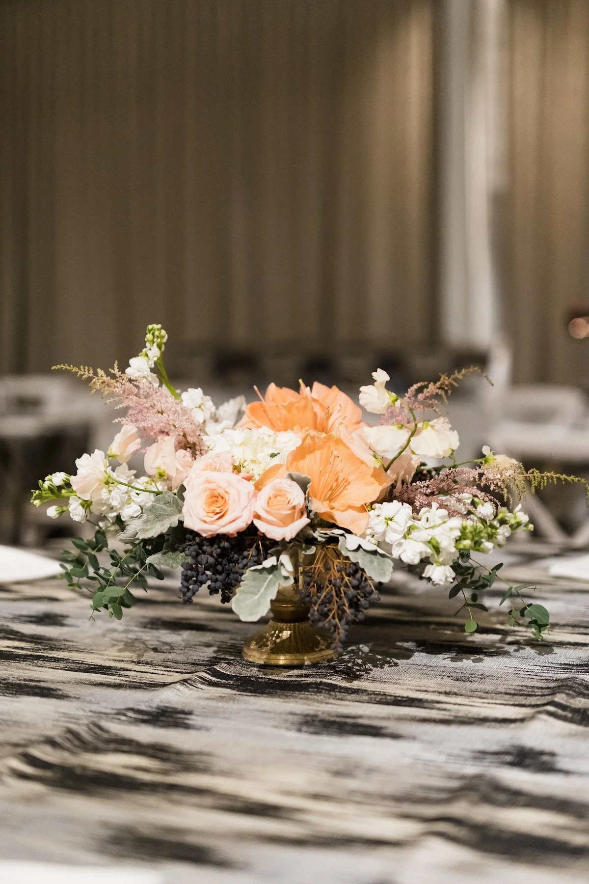 peach floral wedding centerpiece at the whim.jpeg