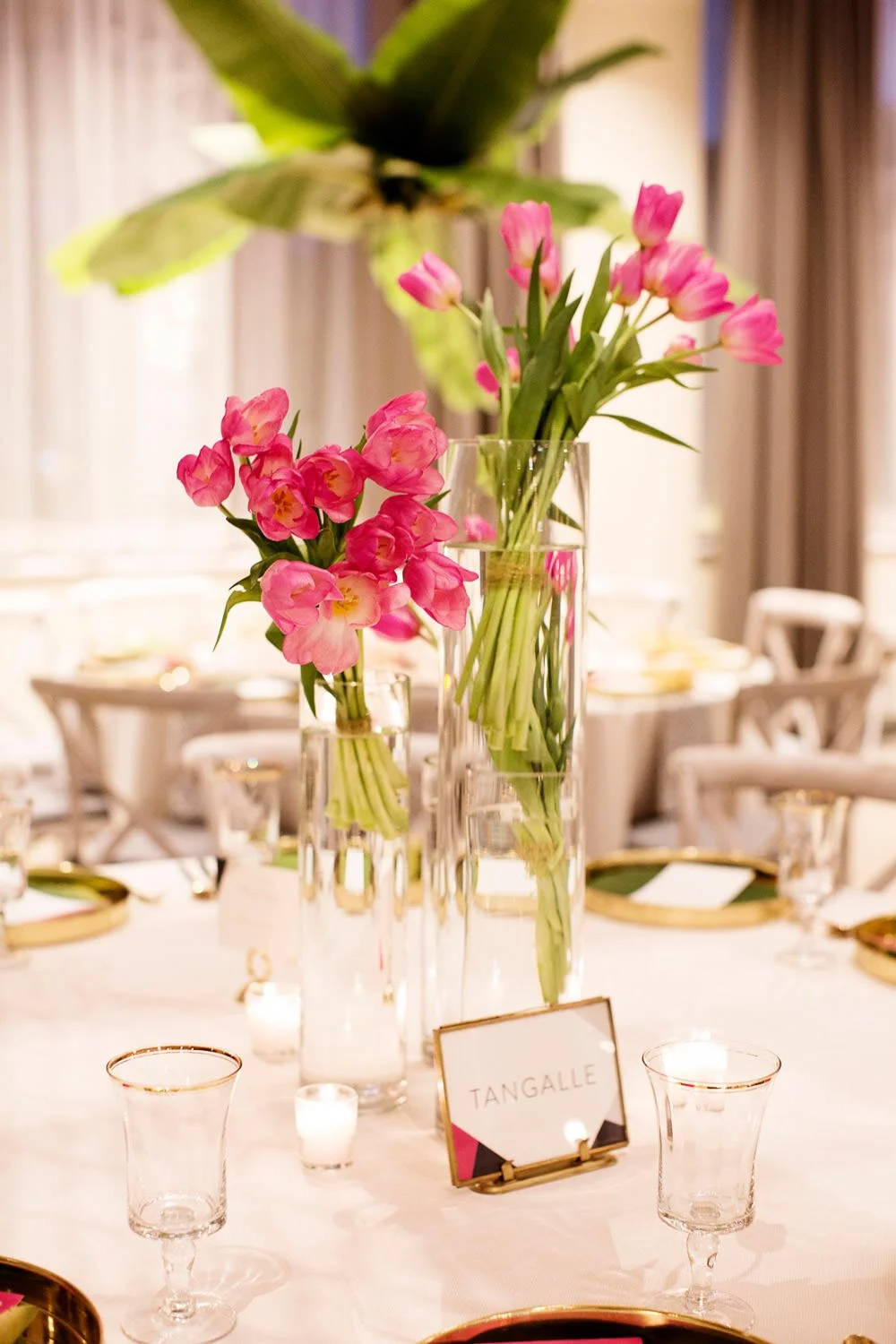 Modern wedding table top decor and pink tulip centerpiece at The Machine Shop, Minneapolis, Minnesota - event design by Rocket Science Events, photo by Photogen Inc.