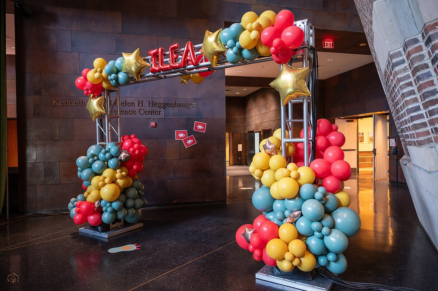 High School themed party design.Welcome arch of colorful balloons in blue, yellow, and red. ILEA Minnesota Star Awards, Designed by Rocket Science Events.