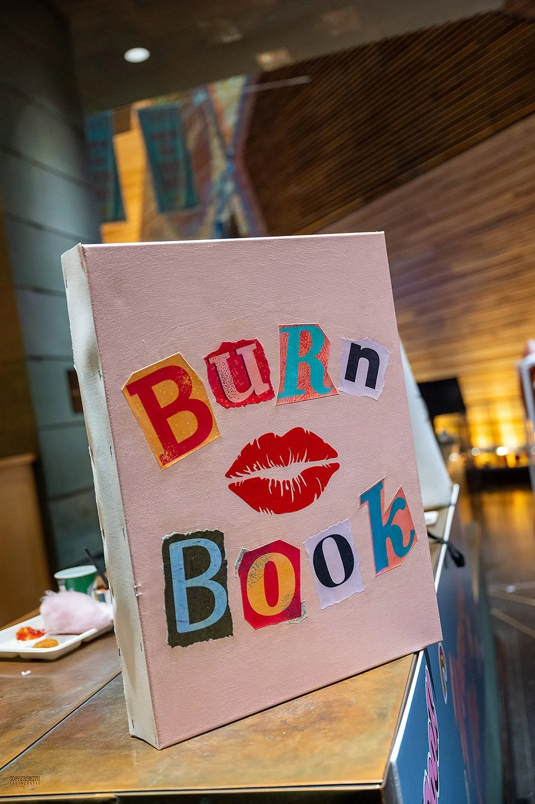 Custom-designed Burn a book decor in library themed area. High School themed party design, ILEA Minnesota Star Awards, Planned by Rocket Science Events.