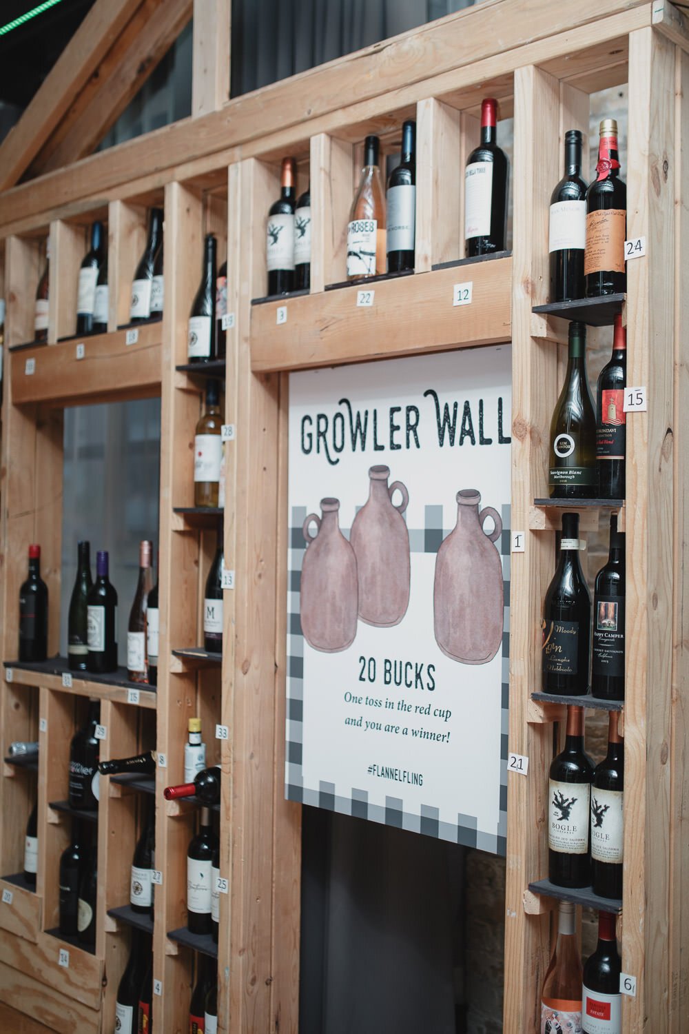 wall display of growlers and wine for Americana farm themed event