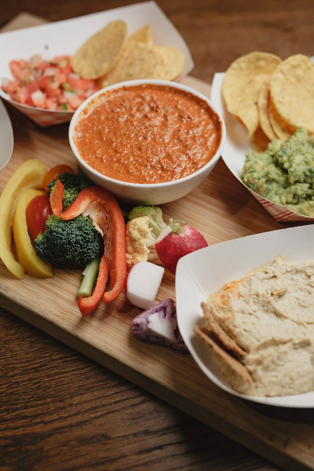 chili, chips and salsa and guacamole, pita and hummus, sliced veggies
