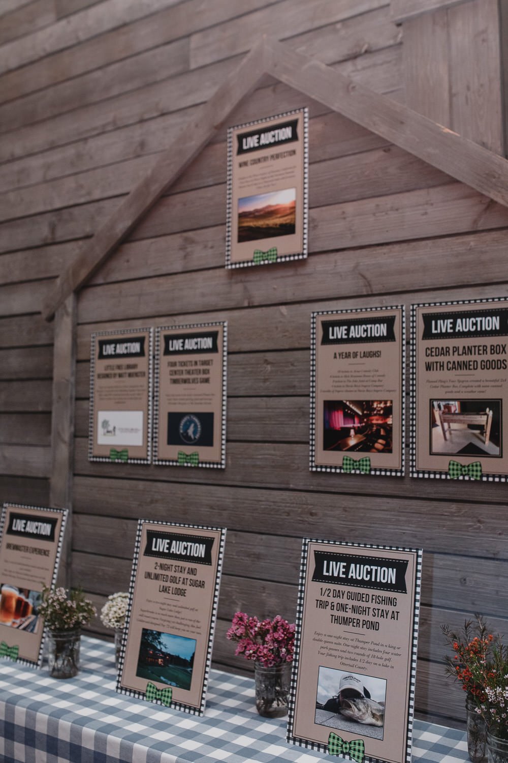 auction items display in front of barn facade for Americana farm themed event