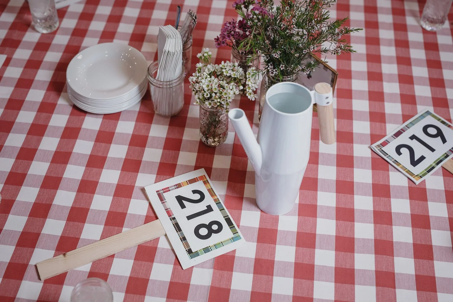 red plaid table cloth with auction numbers