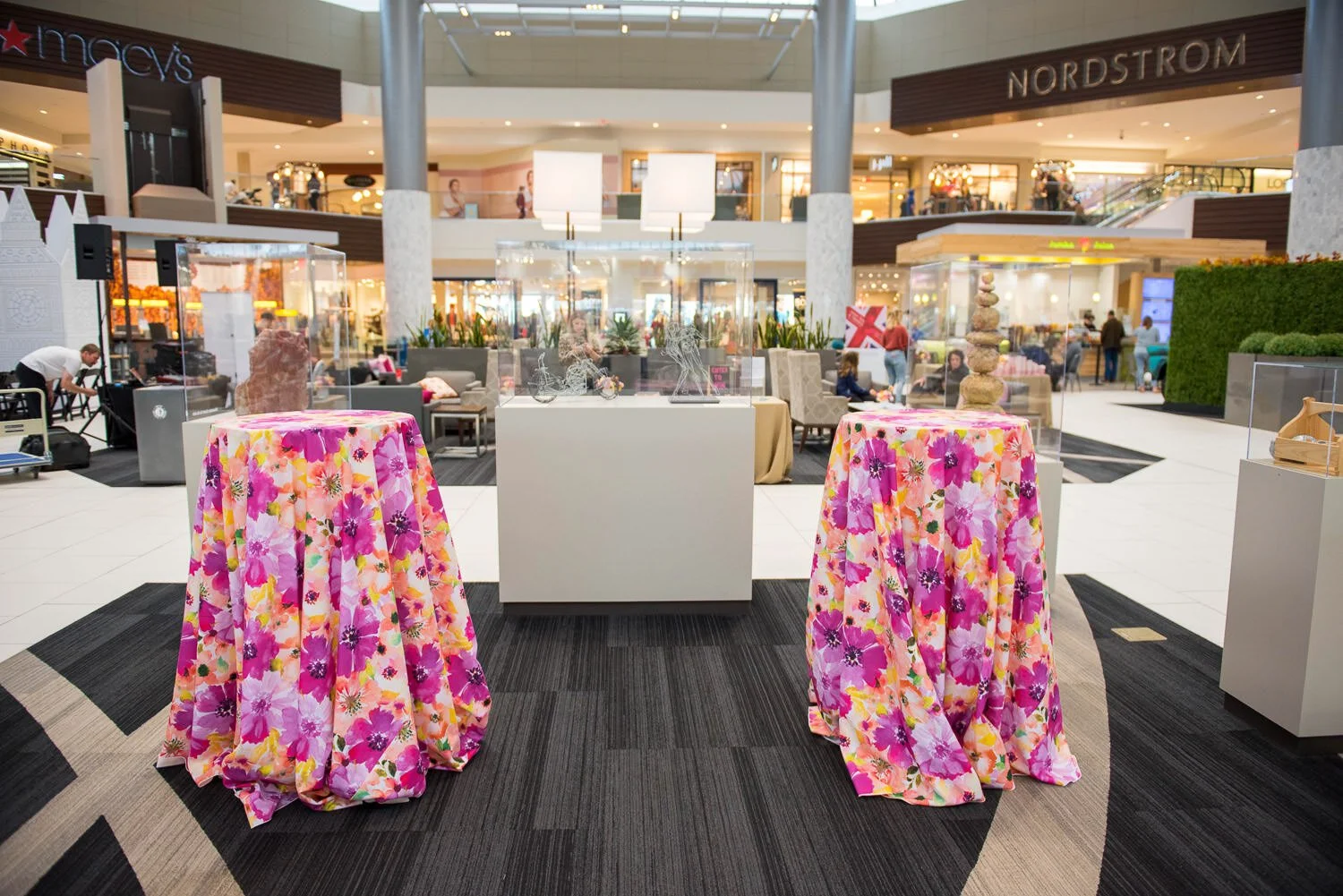 high tables with floral tablecloths