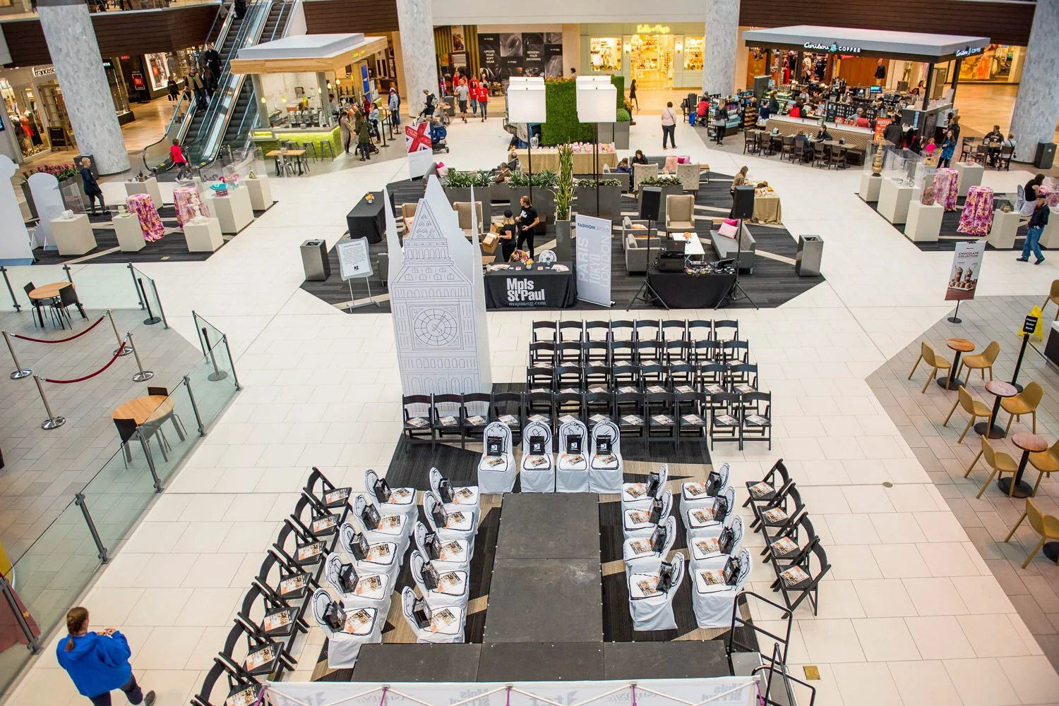 fashion show setup with catwalk, chairs and large paper cutout of big ben for British inspired fashion event