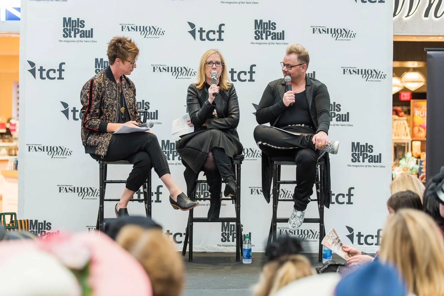 fashion experts sit on stage at British inspired fashion event
