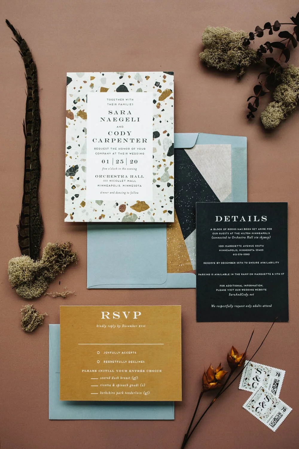 modern geometric wedding invitation suite in mustard yellow, robins egg blue, and charcoal grey with moss, feathers and stamps.