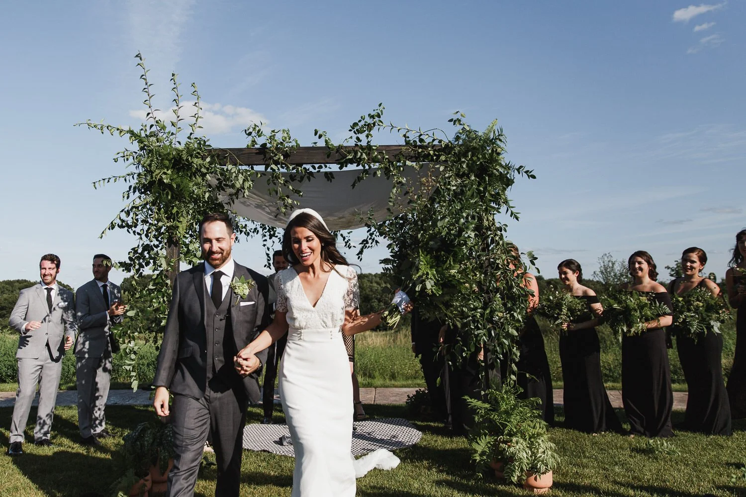 bride and groom walking up the aisle after wedding ceremony