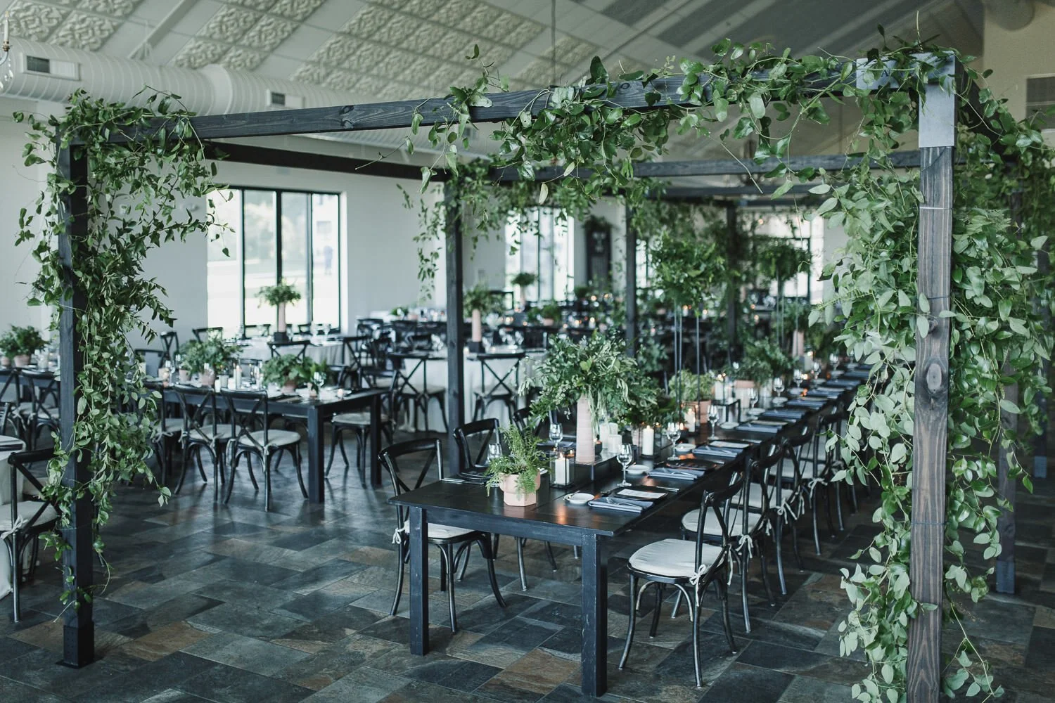 wedding reception tablescapes with black and white design and all green florals
