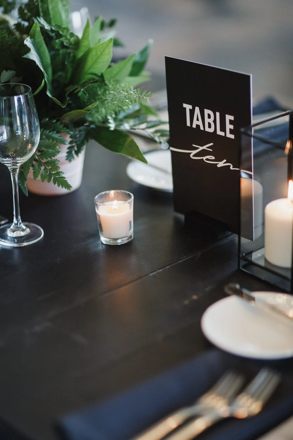 table number black and white table design white votive candle all green centerpiece