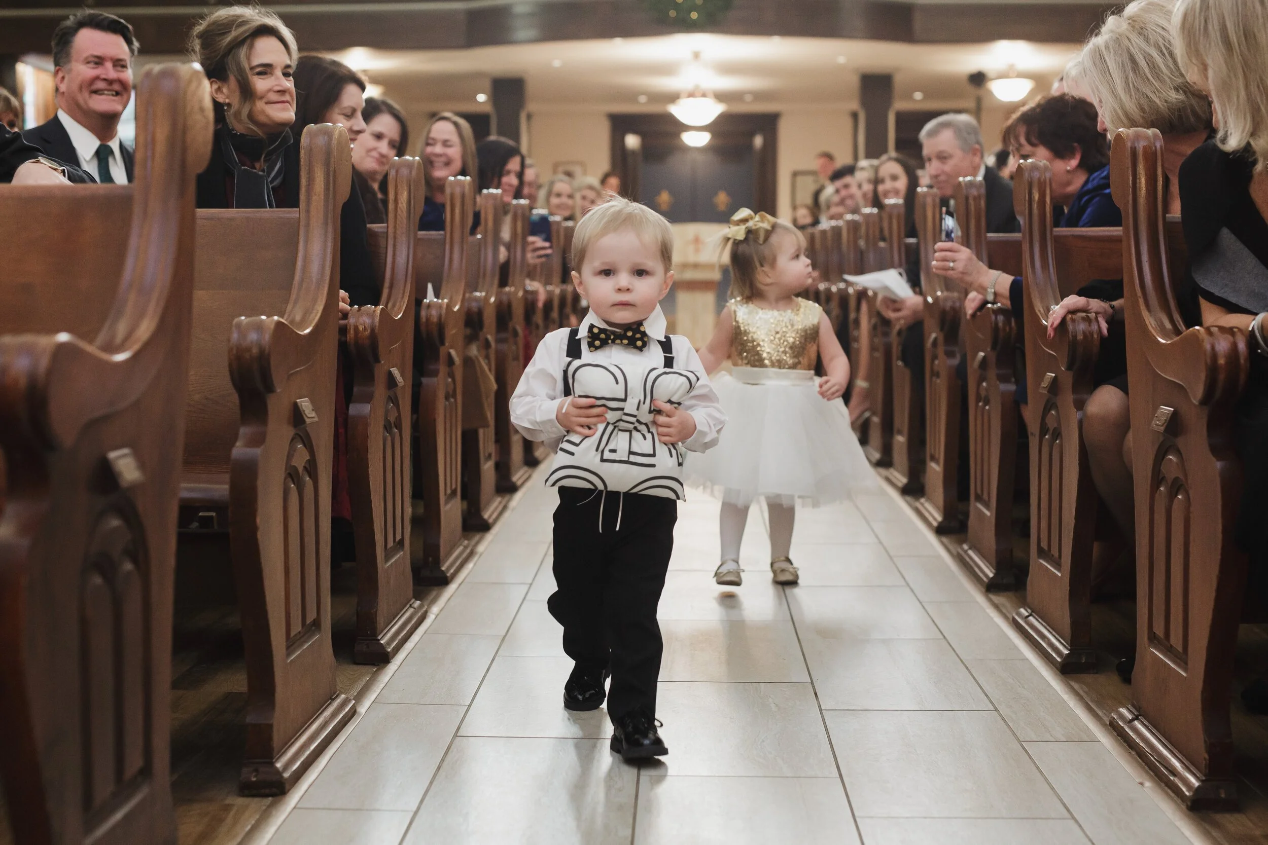 ring bearer and flower girl at wedding ceremony