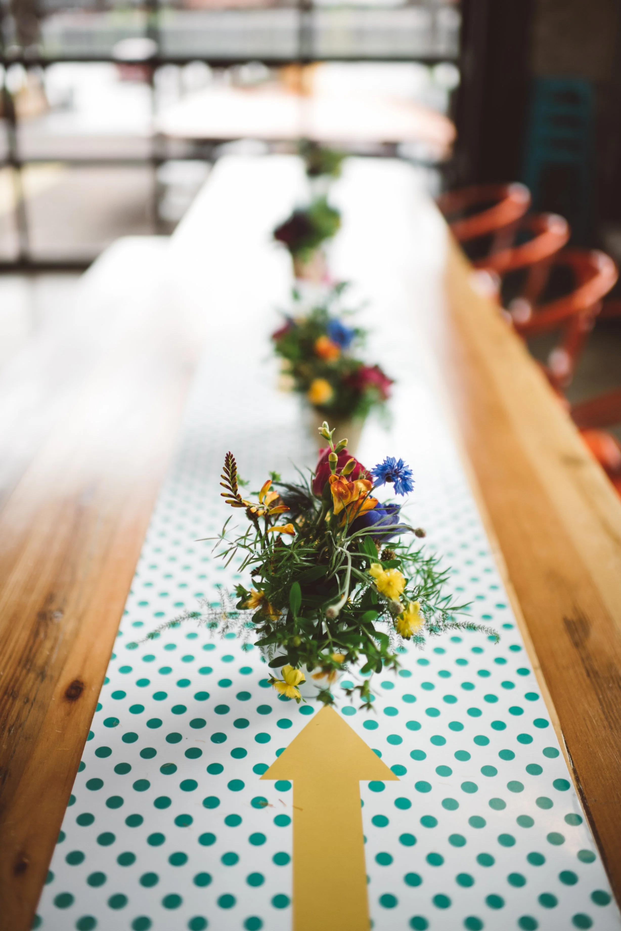 colorful wedding reception tables at Bauhaus Brew Labs