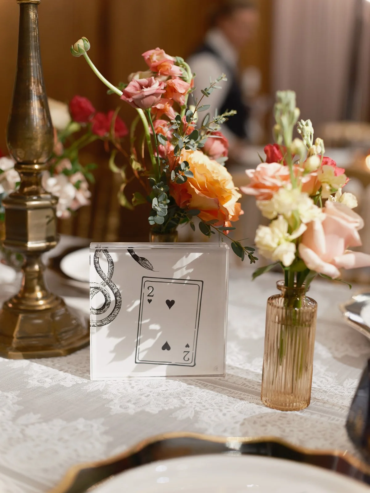 Flowers and playing card inspired table numbers at a Chicago Athletic Association wedding - Rocket Science Events