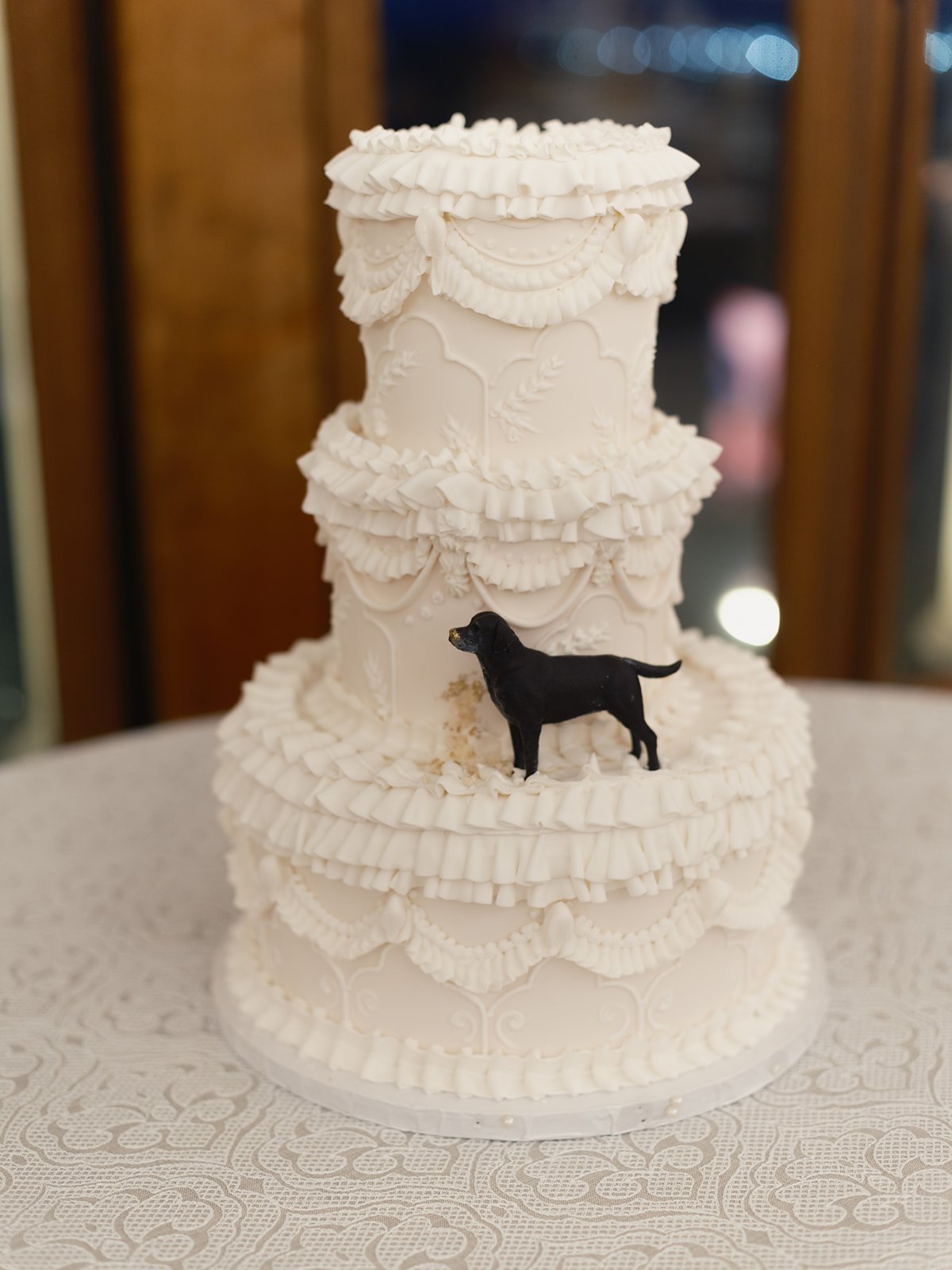 Wedding cake with dog figurine at a Chicago Athletic Association wedding - Rocket Science Events