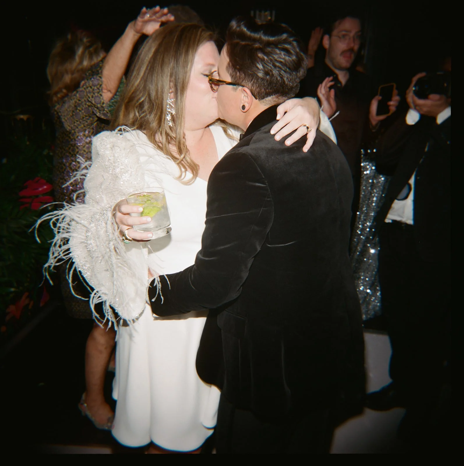 Two brides kissing on the dance floor at a Chicago Athletic Association wedding - Rocket Science Events
