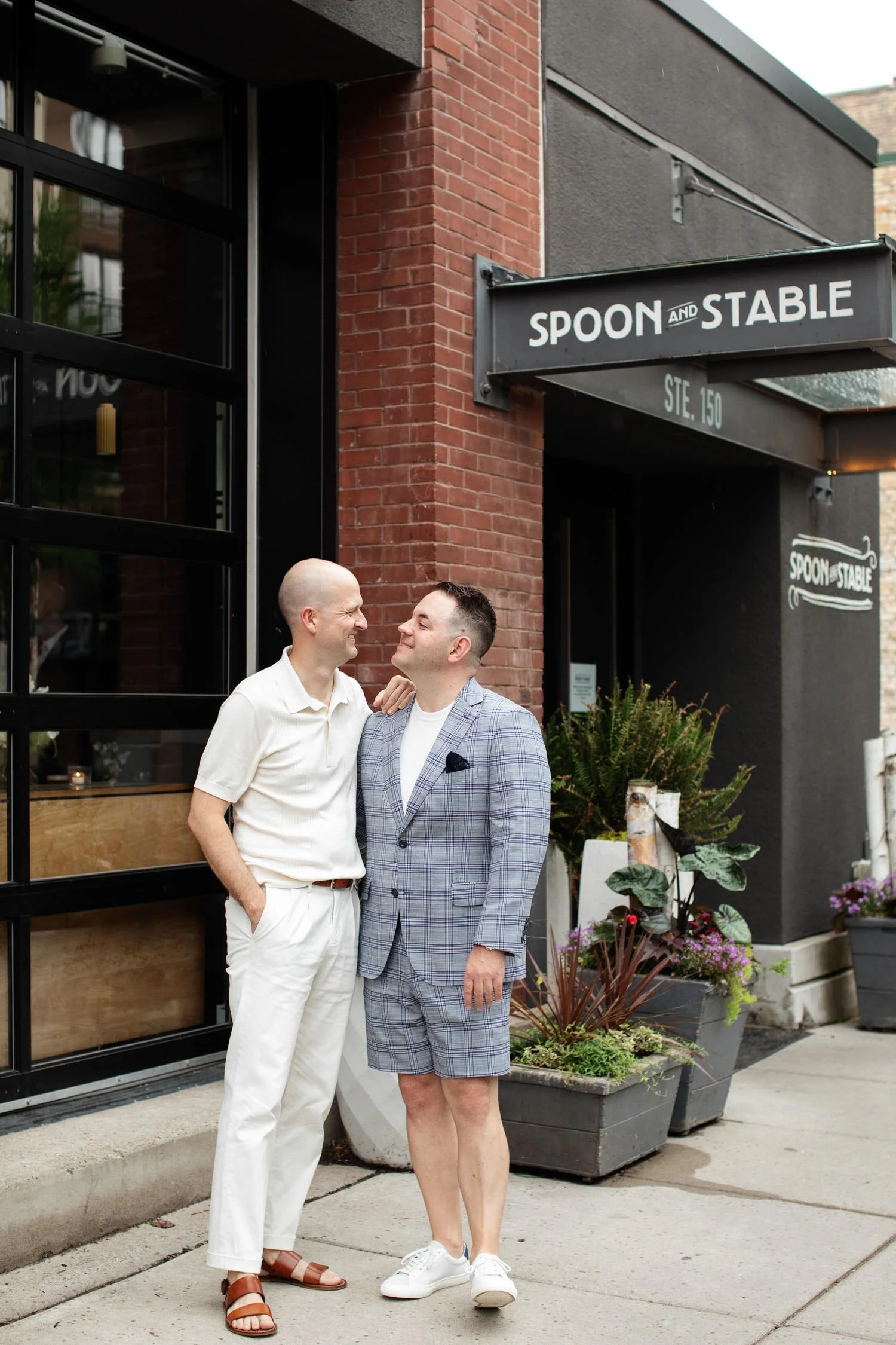 Couple portrait in front of the rehearsal dinner restaurant. Minneapolis rehearsal dinner, Spoon and Stable restaurant, Planned by Rocket Science Events.
