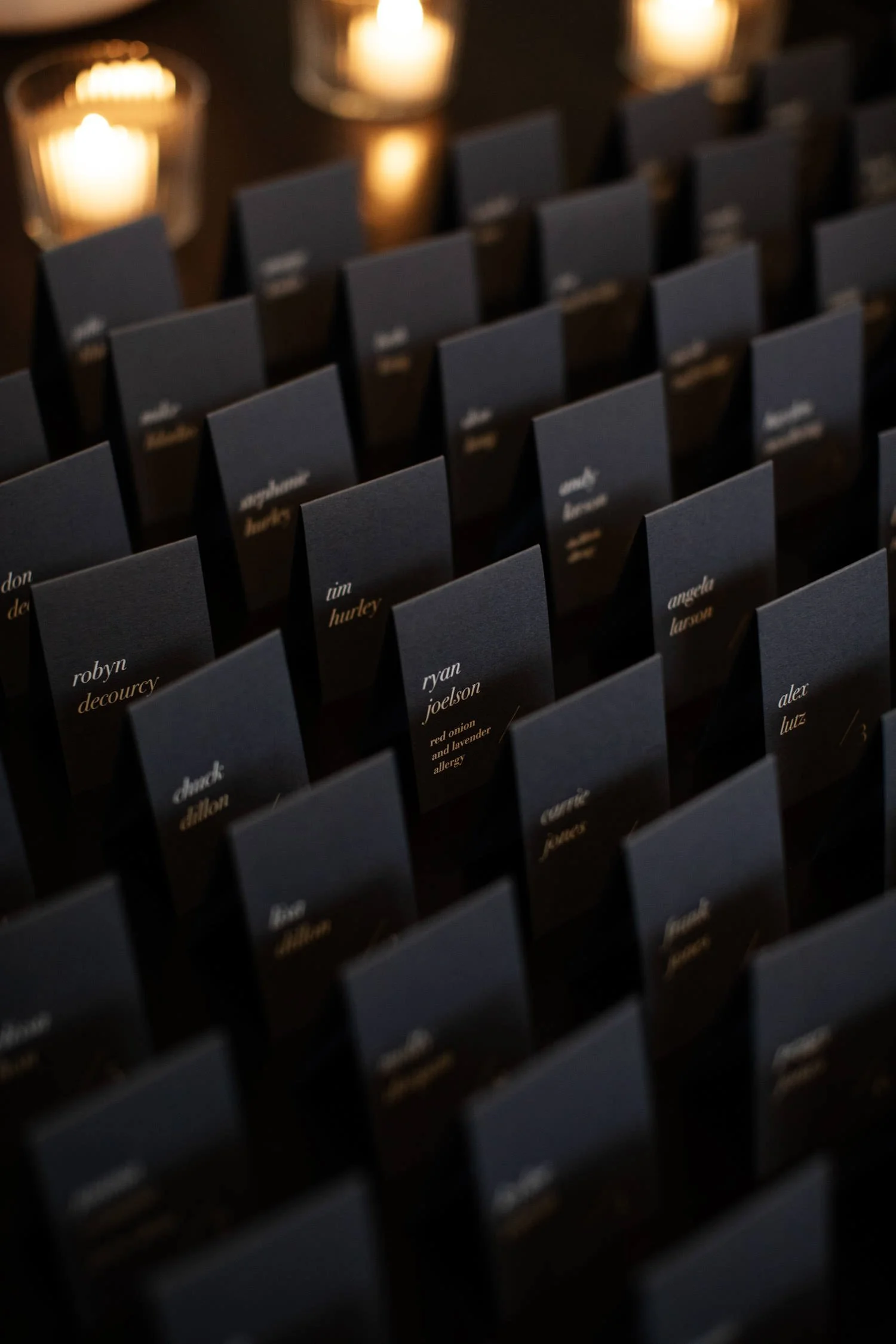 Black custom-designed square folded modern rehearsal dinner place cards. Minneapolis rehearsal dinner, Spoon and Stable restaurant, Designed by Rocket Science Events.