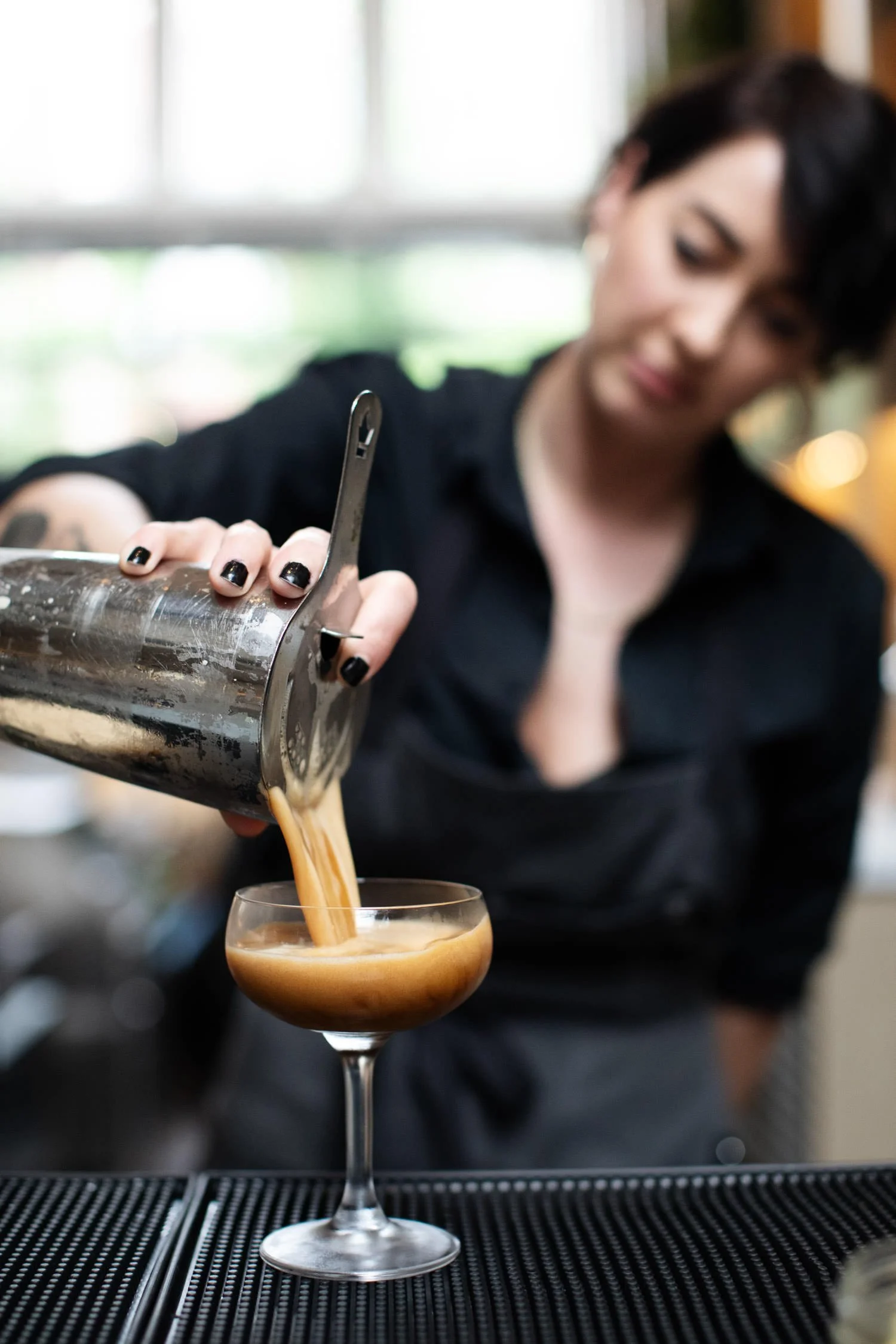 Bartender at rehearsal dinner making a cocktail. Minneapolis rehearsal dinner, Spoon and Stable restaurant, Planned by Rocket Science Events.