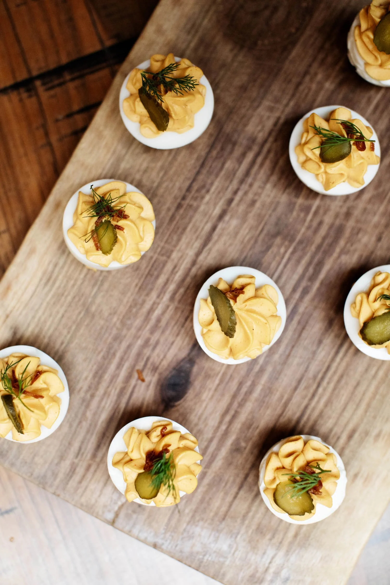 Round deviled eggs hors d'oeuvres prepared by James Beard award-winning chef, Gavin Kaysen. Minneapolis rehearsal dinner, Spoon and Stable restaurant, Planned by Rocket Science Events.