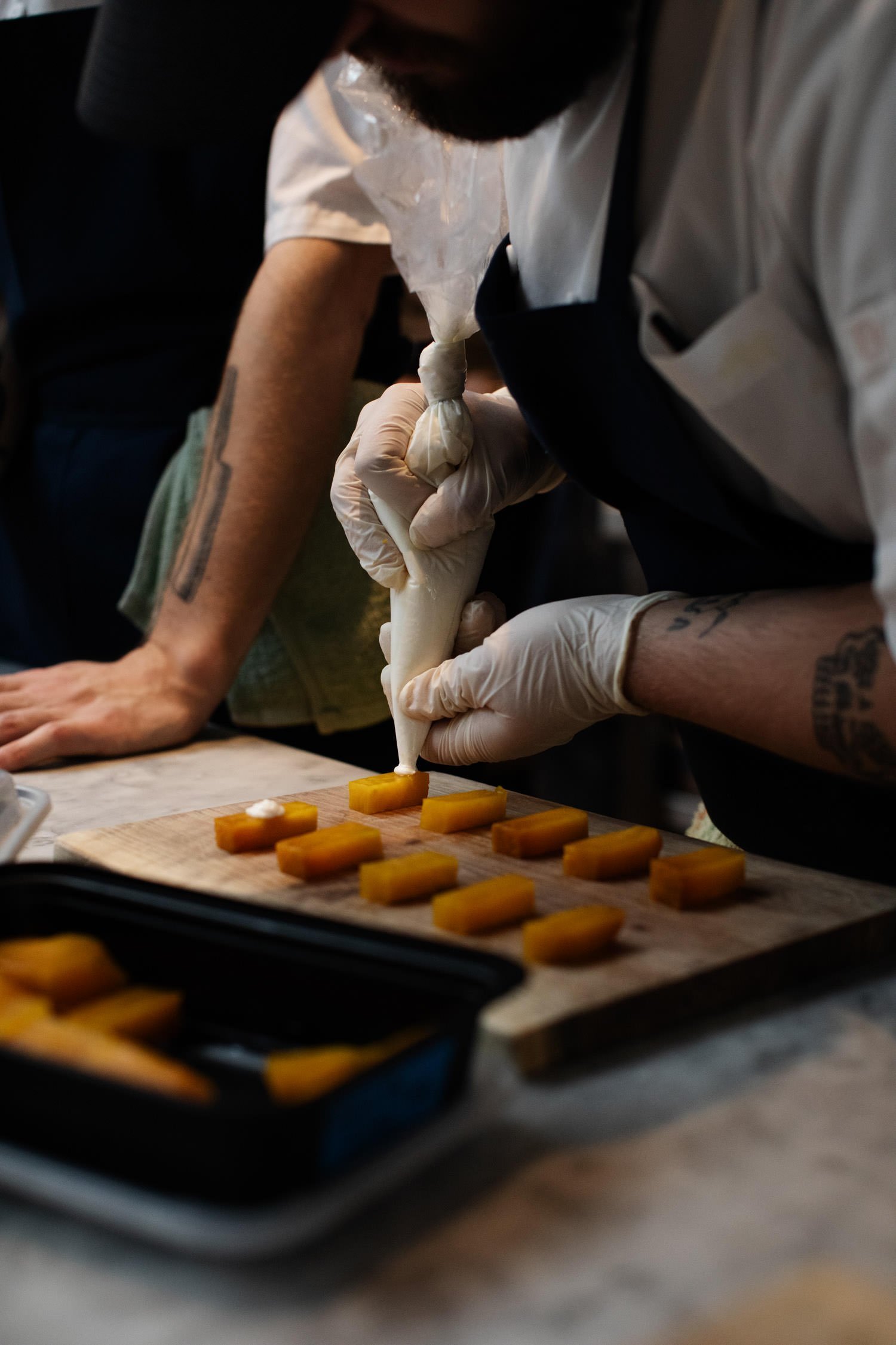 Hors d'oeuvresbeing prepared by James Beard award-winning chef, Gavin Kaysen. Minneapolis rehearsal dinner, Spoon and Stable restaurant, Planned by Rocket Science Events.