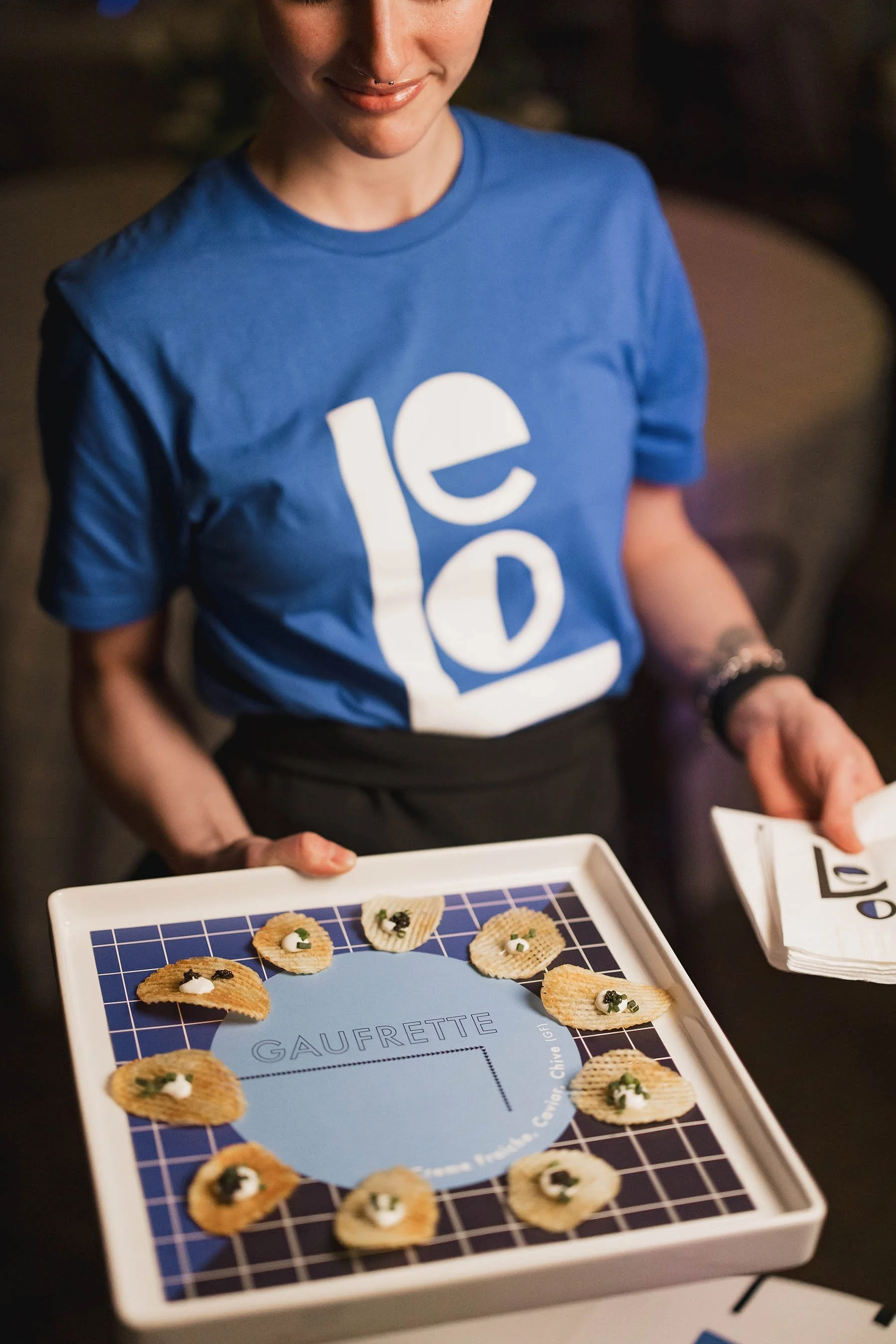 A server holding a tray of appetizers at a Minneapolis Bar Mitzvah planned by Rocket Science Events