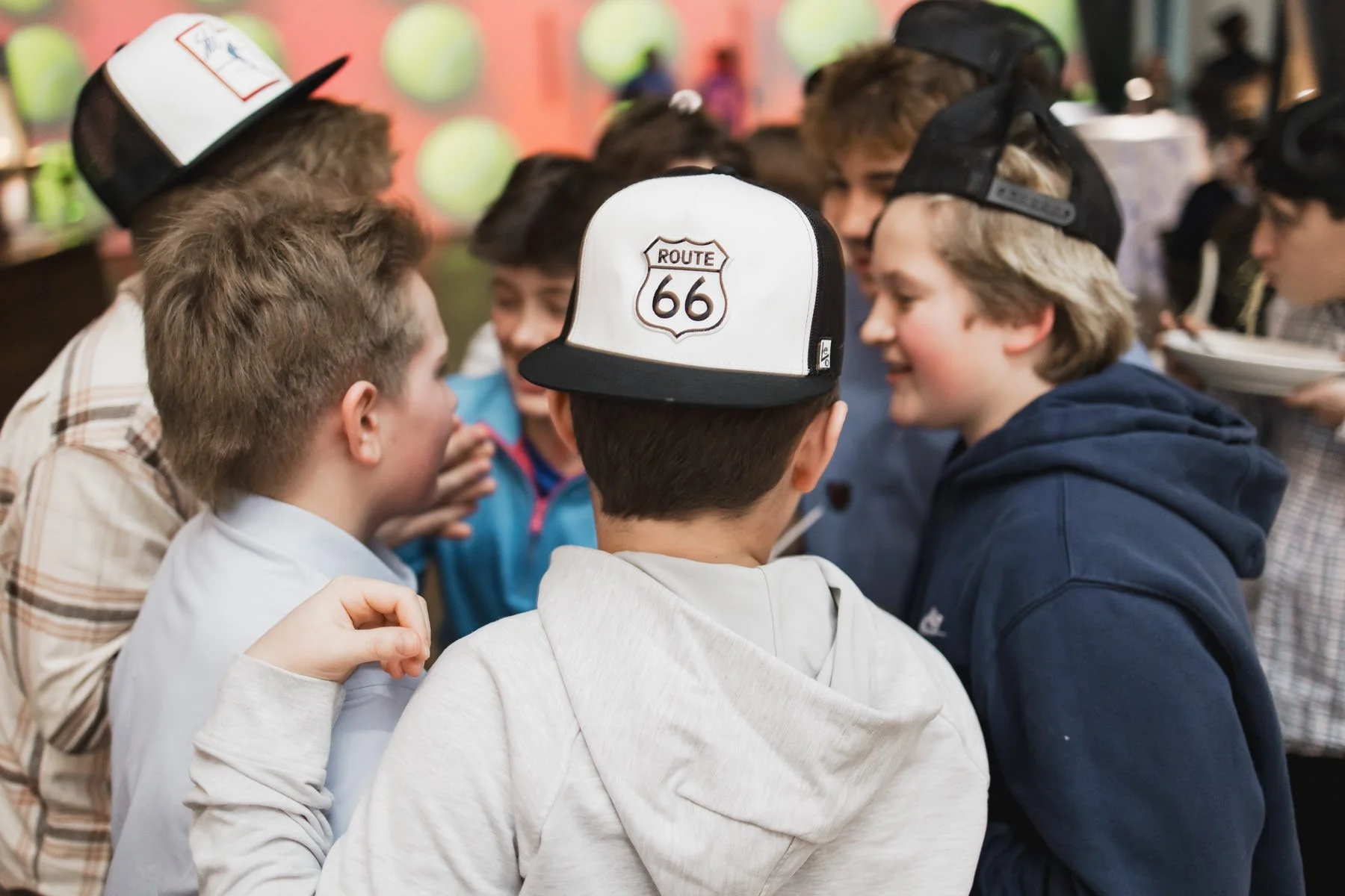 Boys wearing personalized trucker hats at a Minneapolis Bar Mitzvah planned by Rocket Science Events