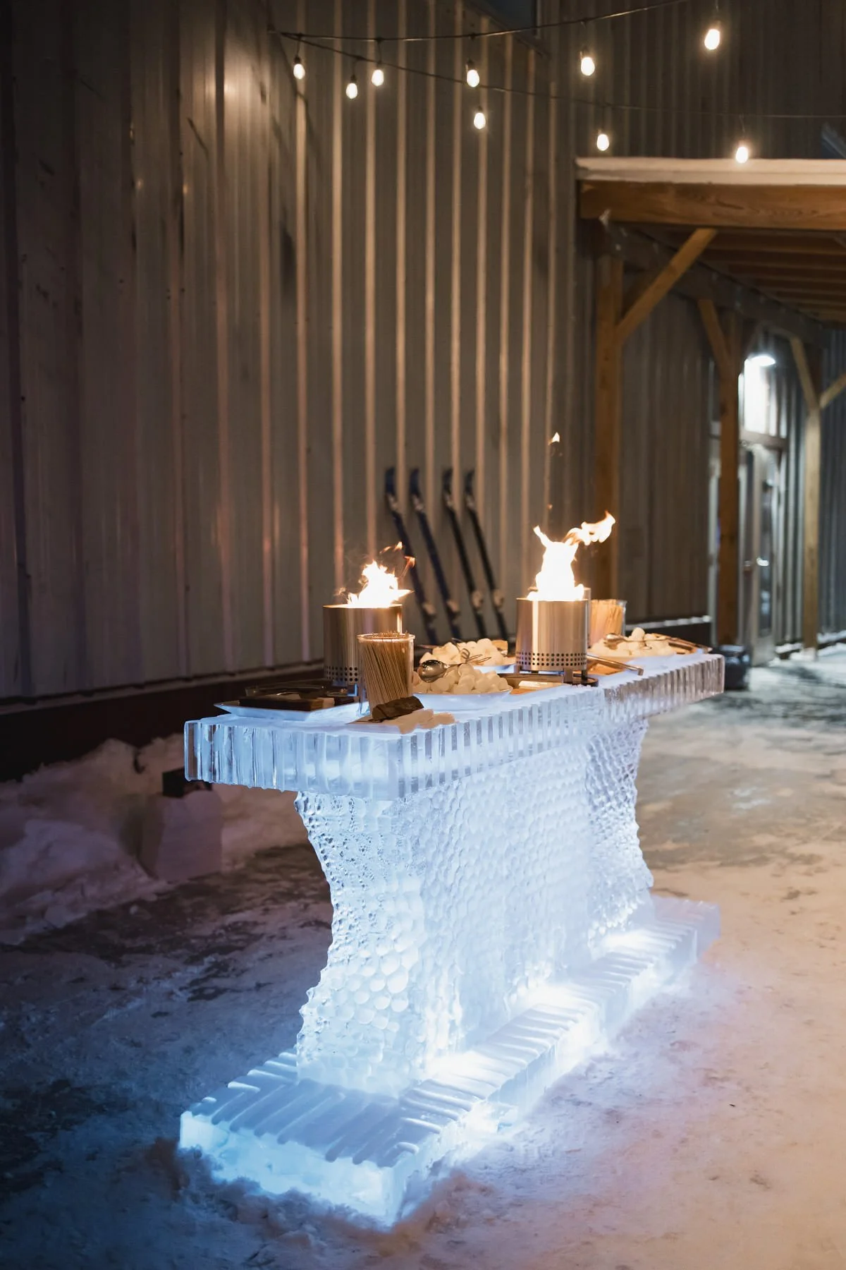 Outdoor ice sculpture table s’mores station at a Minneapolis Bar Mitzvah planned by Rocket Science Events