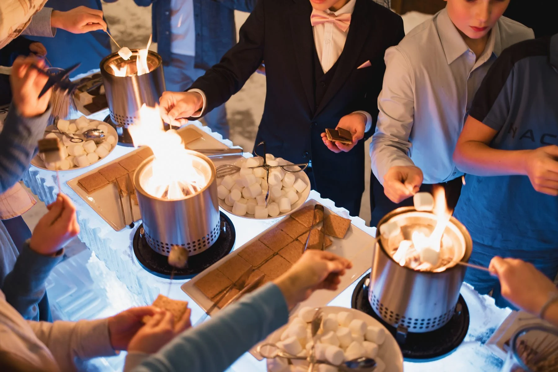Kids making s’mores at a Minneapolis Bar Mitzvah planned by Rocket Science Events