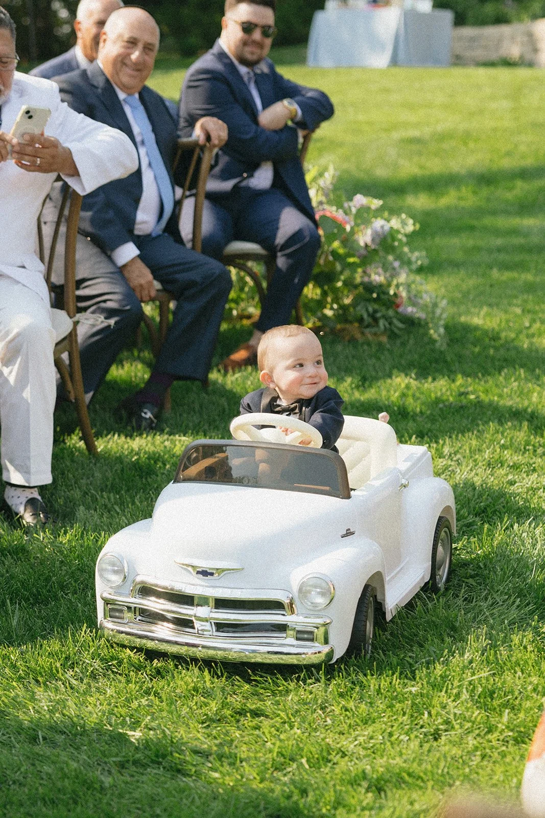 whimsical-garden-wedding-adorable-ring-bearer-in-car-rocket-science-events.jpg