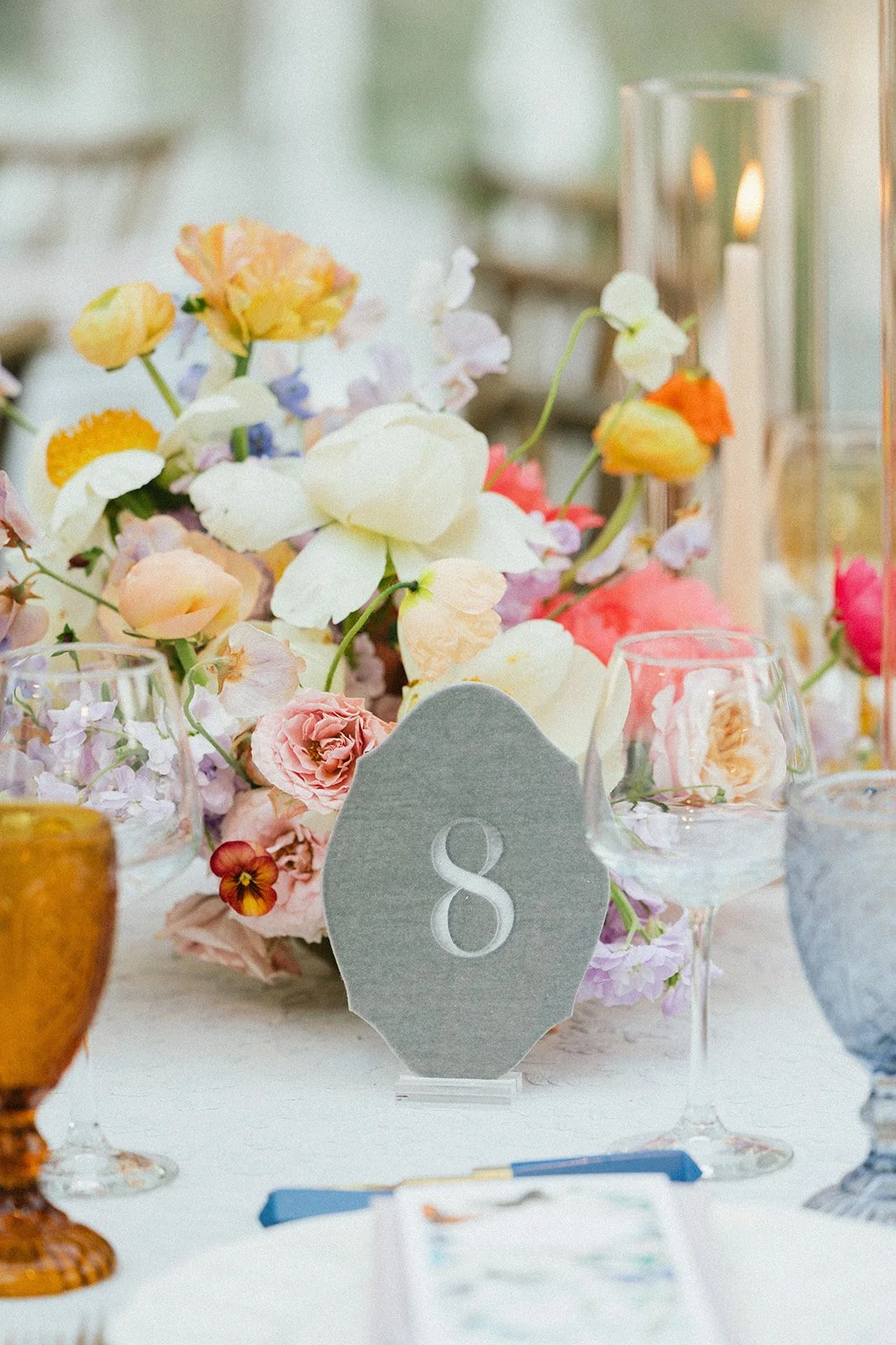 whimsical garden wedding reception table number and pastel florals rocket science events