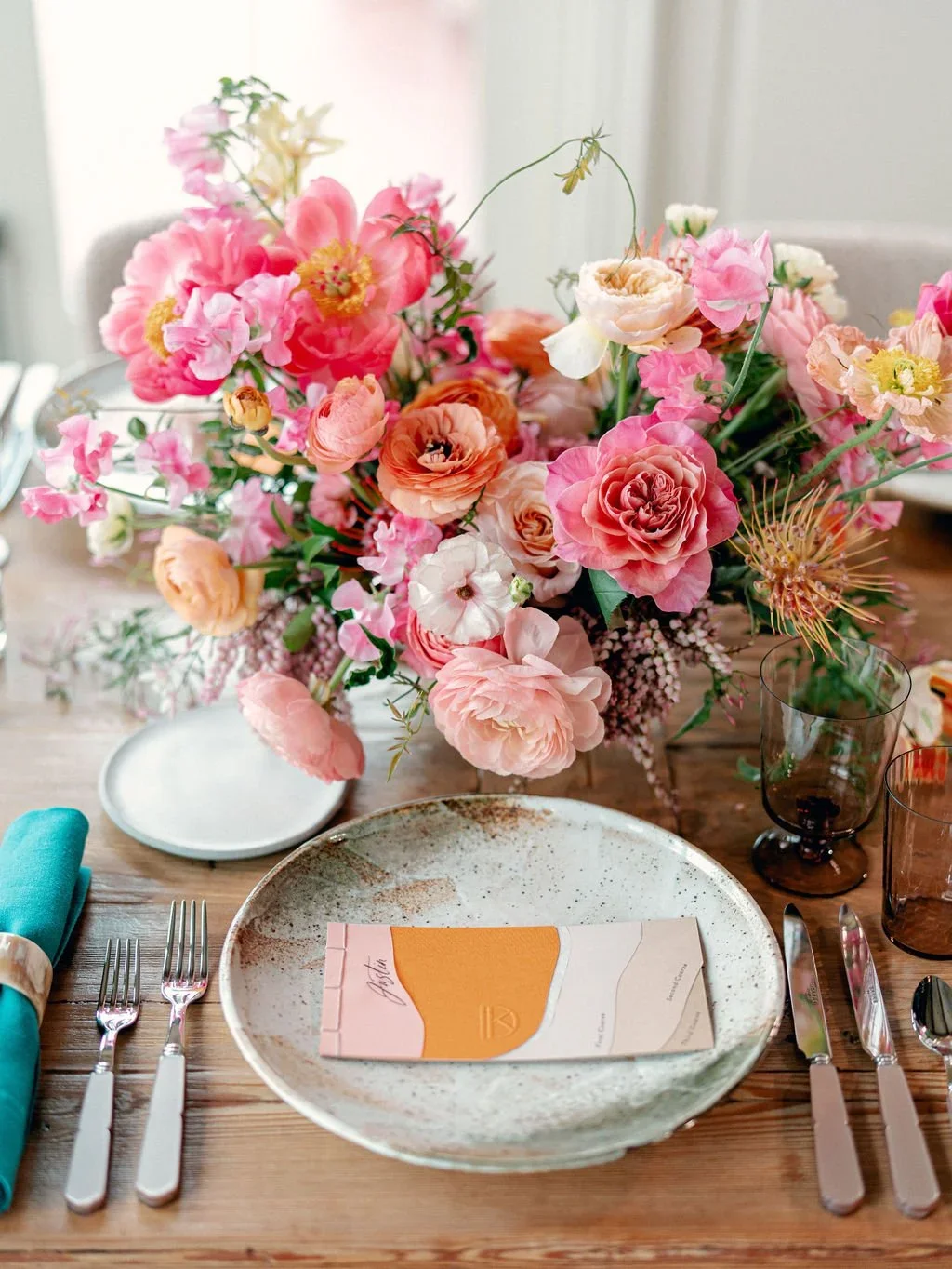  Pink and coral wedding table setting with pottery dinner plate, designed by Rocket Science Events 