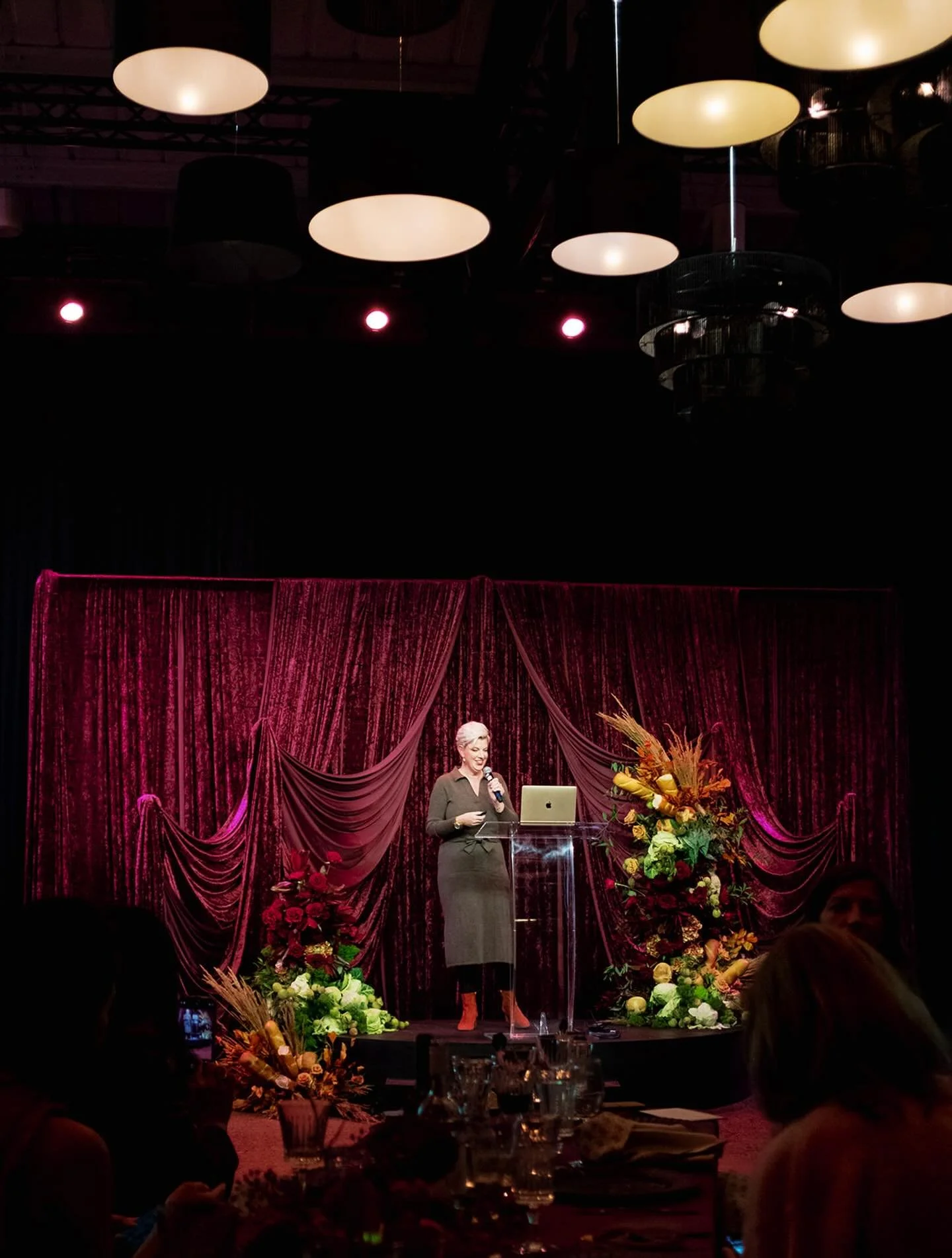 Gretchen Culver, event planner and designer from Rocket Science Events speaking on stage