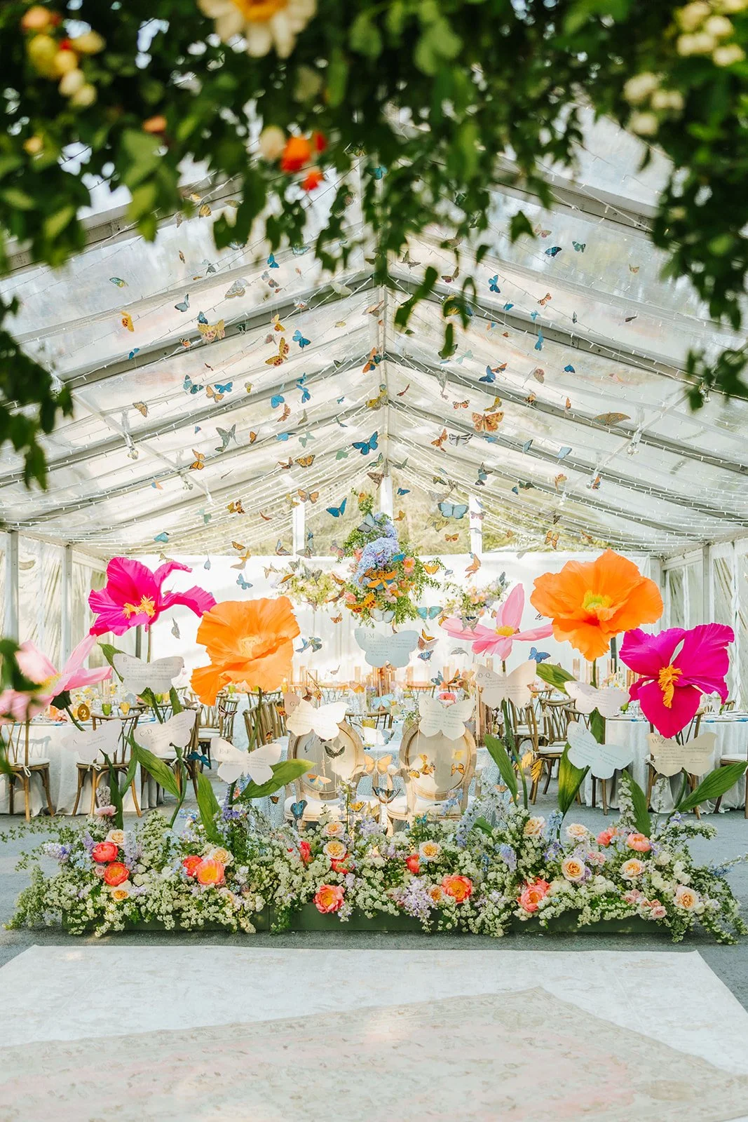 whimsical garden wedding reception design pastel florals and butterflies rocket science events