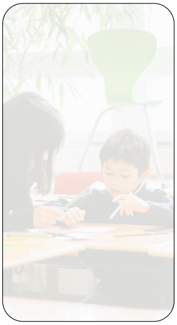 Student and tutor engaged in one-on-one learning in a bright classroom setting