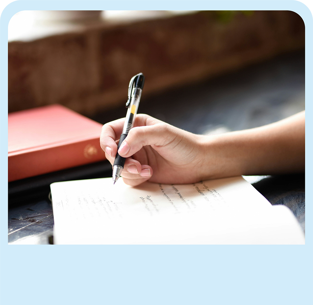 Hand holding a pen, representing the wide scale and endless possibilities of general academic tutoring