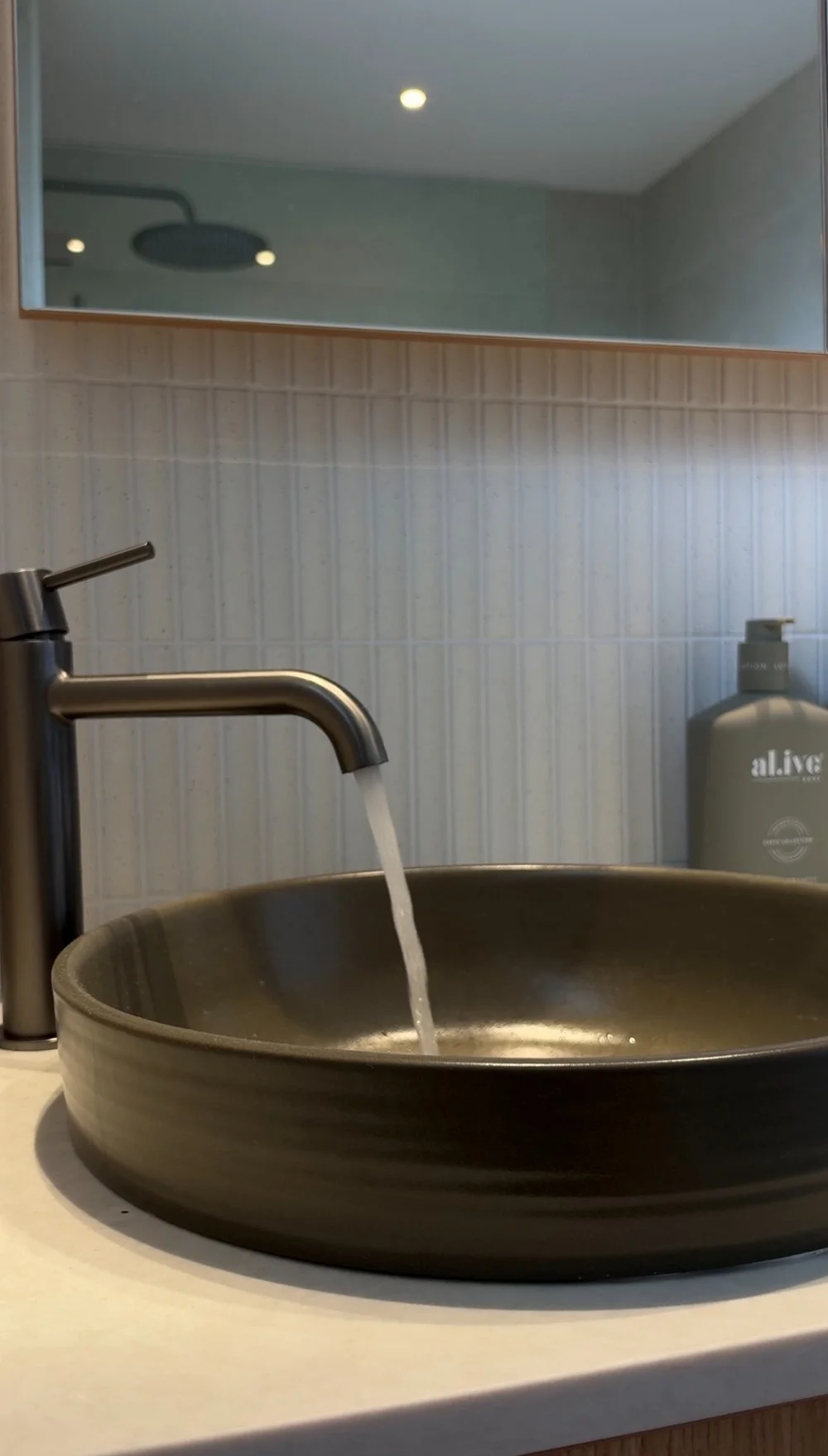 Sculptural olive green basin