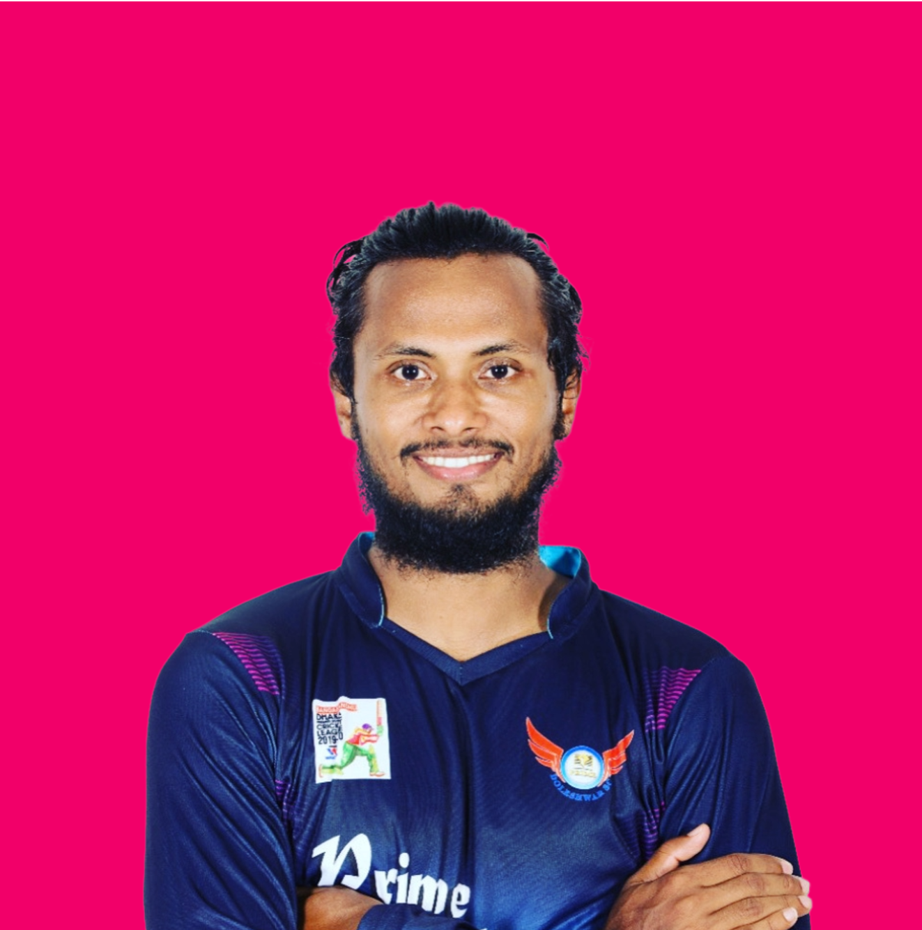 Portrait of a smiling man with a beard and long hair, wearing a dark blue sports jersey against a solid pink background.
