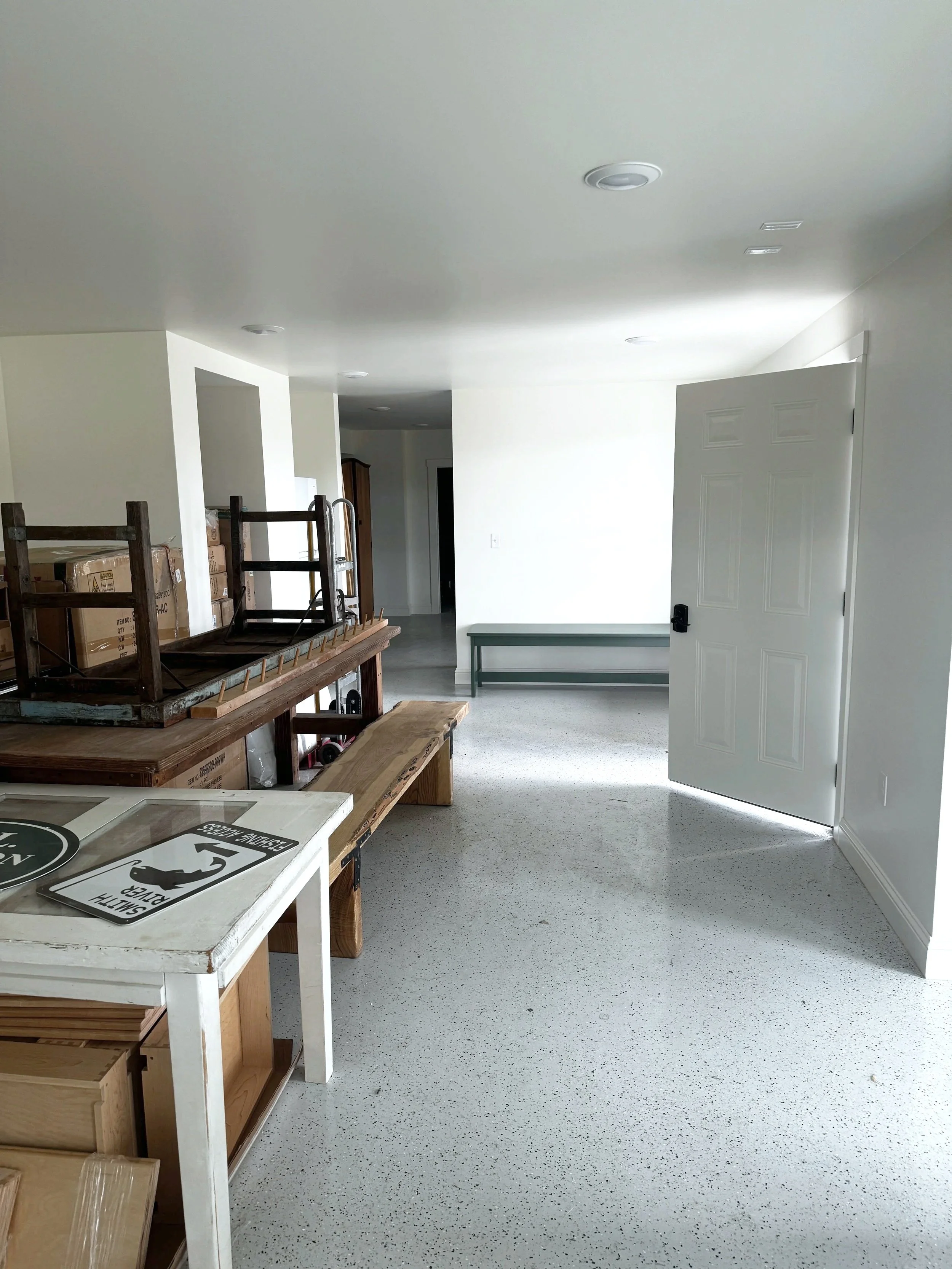 Basement finish — after drywall was painted, we installed a broadcast flake epoxy floor system for a durable, easy-clean surface.