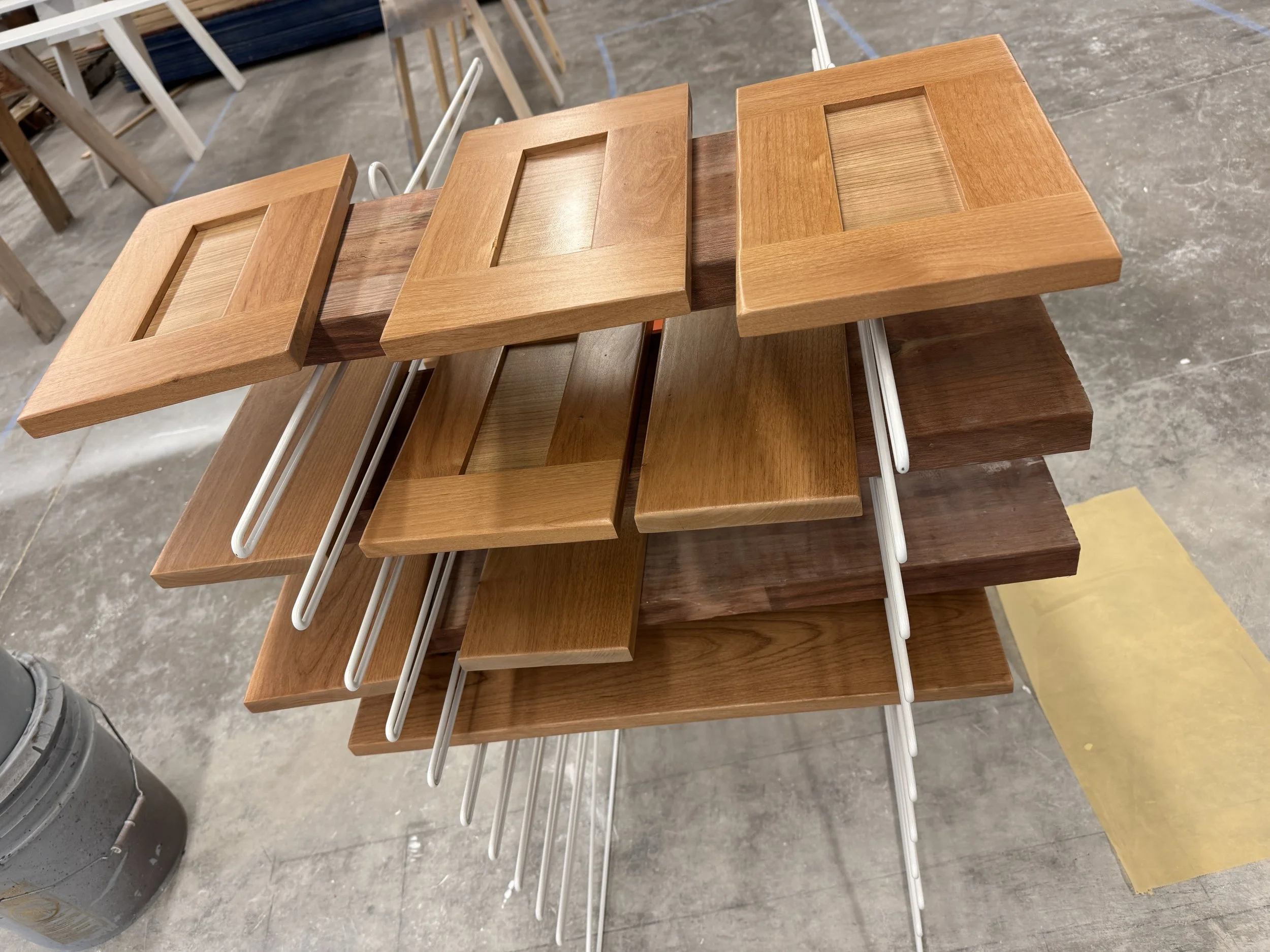 Vanity doors and drawer fronts sprayed with a smooth satin finish—cabinet refinishing in Missoula, Montana.