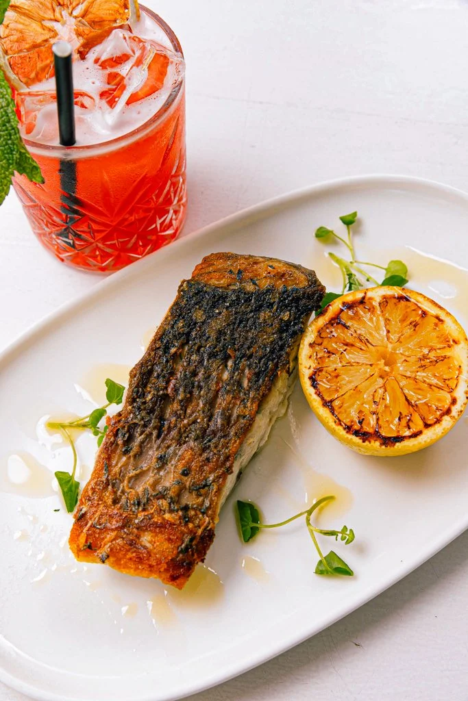 Crispy Skin Barramundi with Pomegranate salad, whipped caviar roe, grilled lemon