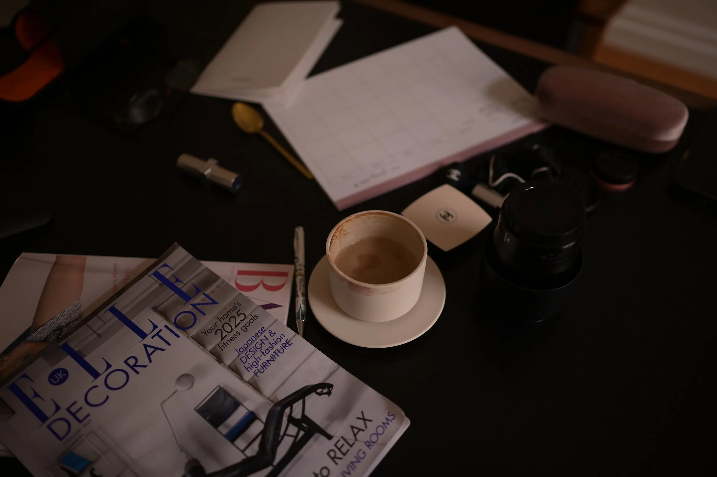 Coffee on the table. Messy office does not care.
