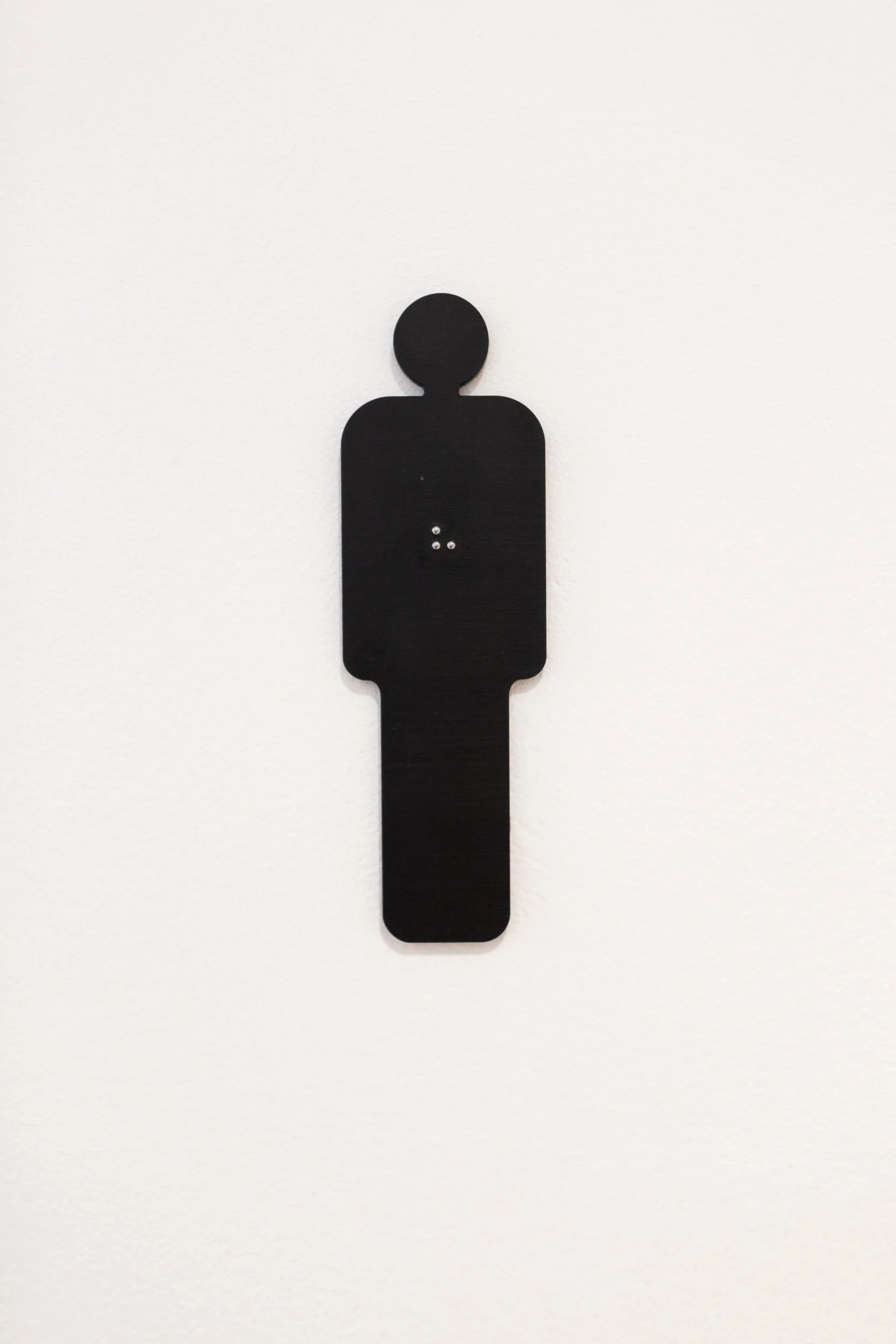 Pictogramme représentant une silhouette humaine, symbole du design inclusif et de l’accessibilité universelle.